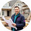 Home improvement project manager holding plans at a residential renovation site